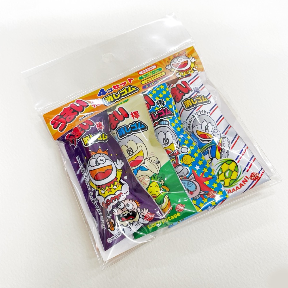 イワコー × やおきん うまい棒消しゴム 4 コセット 商品全景 — めんたい・コーンポタージュ・とんかつソース・シュガーラスク 4 種、實物うまい棒そのままのパッケージ